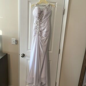 White beaded full length dress with pleated bodice.